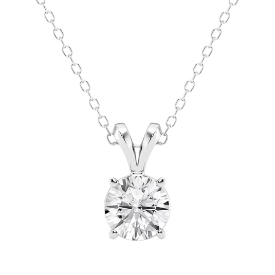 A silver chain necklace features a round, brilliant-cut diamond solitaire held by a four-prong setting.