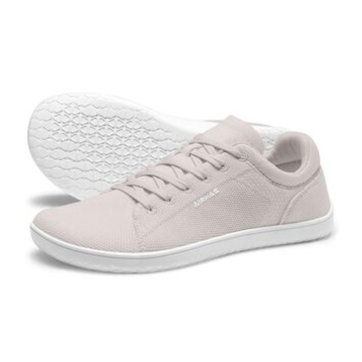 Pair of light pink sneakers with white soles, featuring a lace-up design and textured grip bottom.