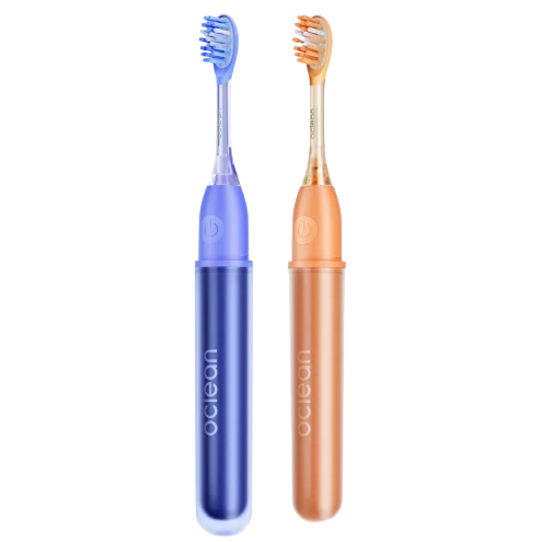 Two electric toothbrushes, one in blue and the other in orange, with a sleek design and curved bristles.