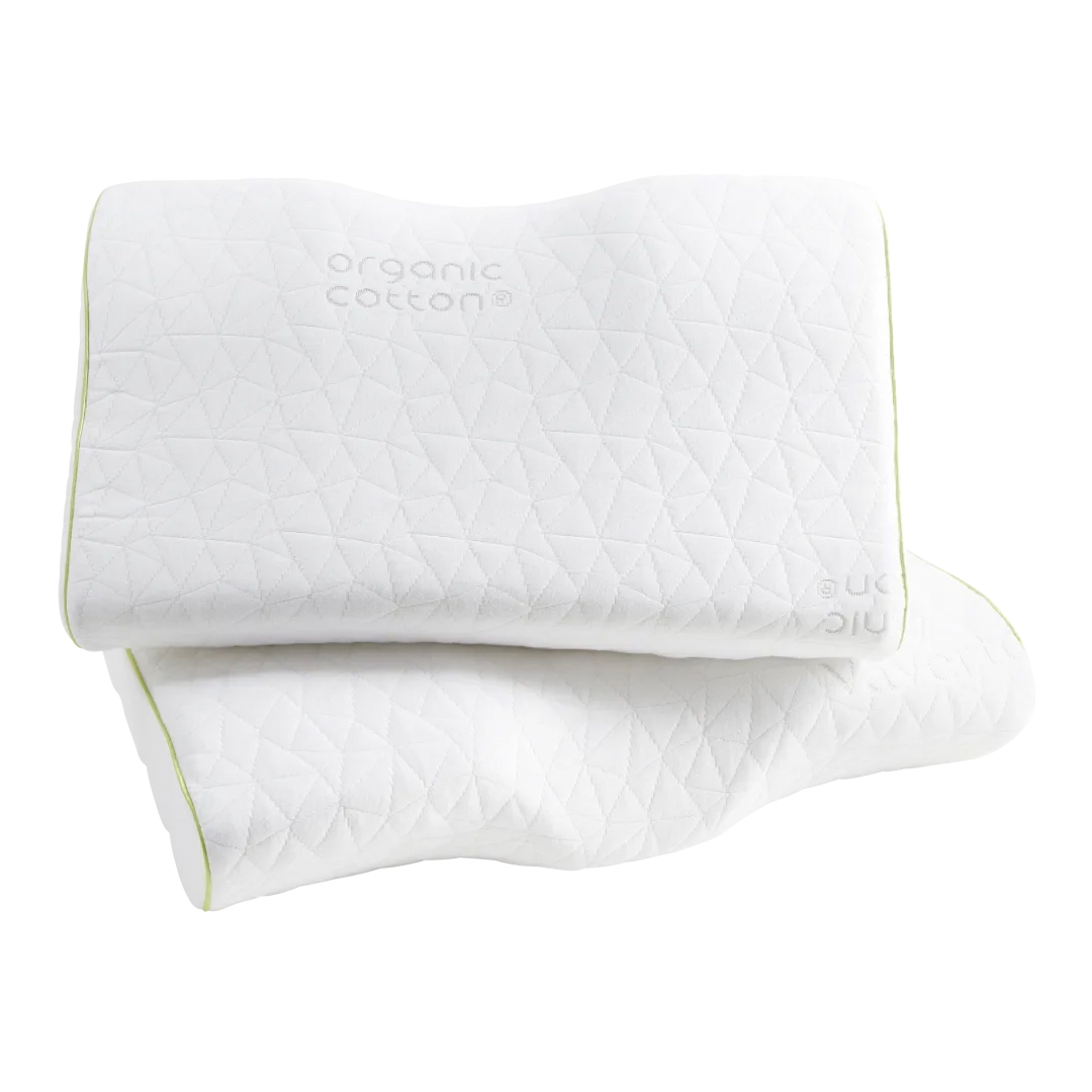 A set of two white, contour-shaped pillows made from organic cotton with a textured triangular pattern and light green piping along the edges.