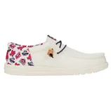 Cream-colored slip-on shoe with a unique red and blue graphic pattern on the heel and collar, featuring dark lace accents and a tan leather detail.