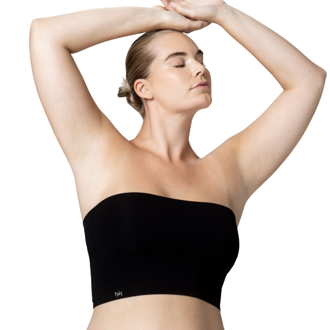 A person is wearing a black strapless bandeau top and black bikini-style bottoms against a neutral background.