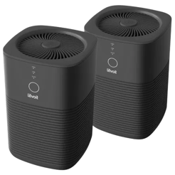 Two Levoit air purifiers with a sleek, black design, featuring circular control panels on the front and vent openings on the top.