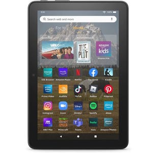 Amazon Fire tablet displaying various app icons on its screen.
