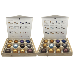Two boxes containing Nespresso coffee pods of various colors, each arranged in a 5x3 grid. The boxes have labels detailing different coffee types such as espresso, double espresso, gran lungo, and barista creations.