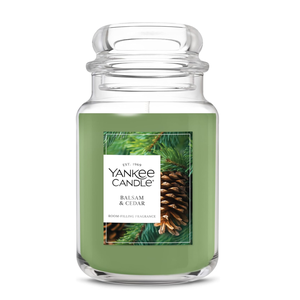 Yankee Candle Balsam & Cedar scented candle with a green wax, featuring a pine and cedar fragrance.