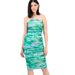 Strapless bodycon dress with a green and purple water-like pattern. The dress features a ruched design and knee-length cut.
