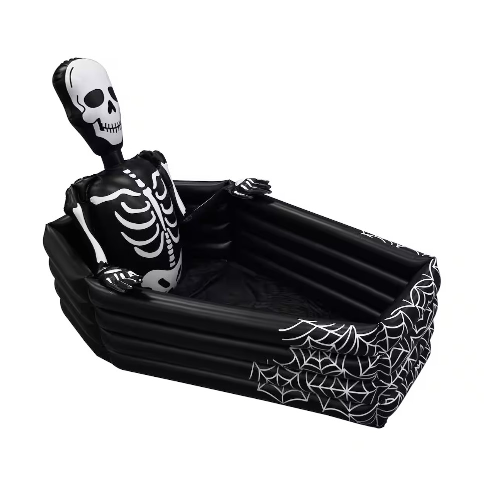 An inflatable cooler designed like a coffin, featuring a skeleton graphic inside, complete with rib cage and spider web detailing on the exterior.