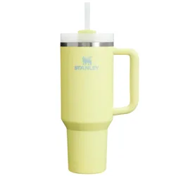 A yellow Stanley insulated travel mug with a handle and a lid featuring a straw.