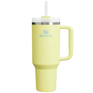 A yellow Stanley insulated travel mug with a handle and a lid featuring a straw.
