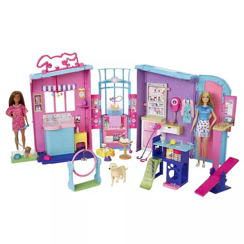 A playset featuring a pet care center with various accessories, including two dolls, a grooming area, agility toys for pets, and a small dog figure, all set in a colorful pink and blue environment.