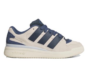 Adidas sneaker in beige with navy accents, featuring the brand's signature three stripes and logo.