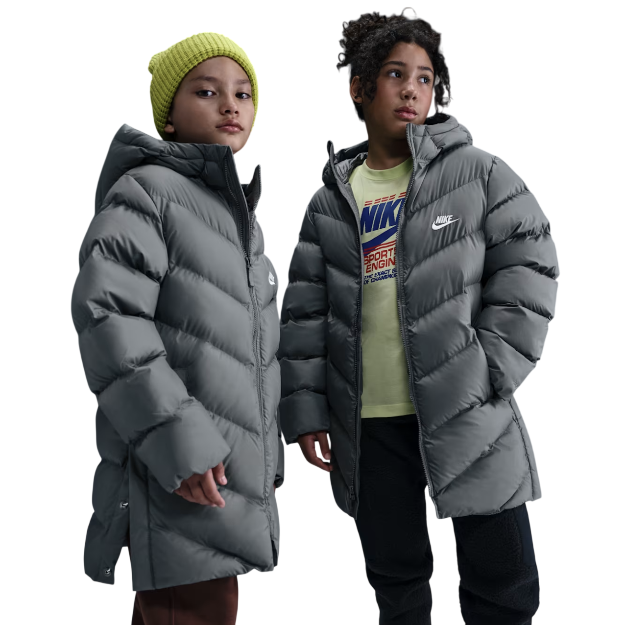 Two children wearing gray Nike puffer jackets. The child on the left has a yellow beanie and the one on the right wears a shirt with a Nike logo.
