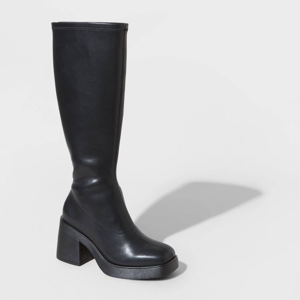 Black knee-high boot with a chunky high heel.