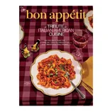 Bon Appétit magazine cover featuring a tribute to Italian American cuisine, showcasing a plate of pasta with bolognese sauce and a glass of red wine on a checkered tablecloth.