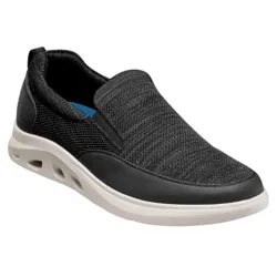 A black slip-on sneaker featuring a woven fabric upper, black detailing, and a cushioned white sole with side cutouts for ventilation.