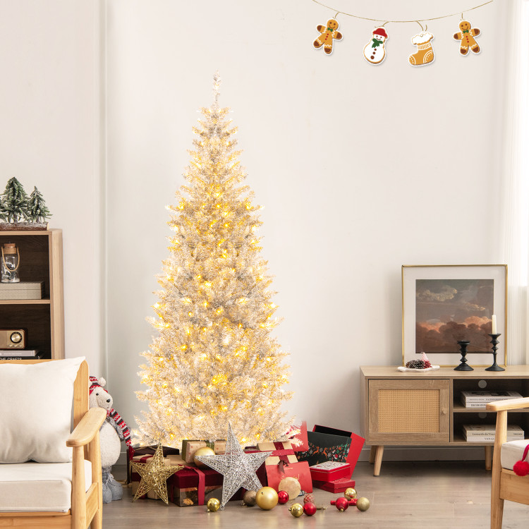 White artificial Christmas tree with warm white LED lights, surrounded by red and gold gift boxes and ornaments; includes decorative wall hangings of gingerbread figures and a snowman above.