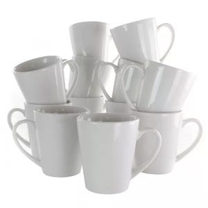 A stack of plain white ceramic mugs.