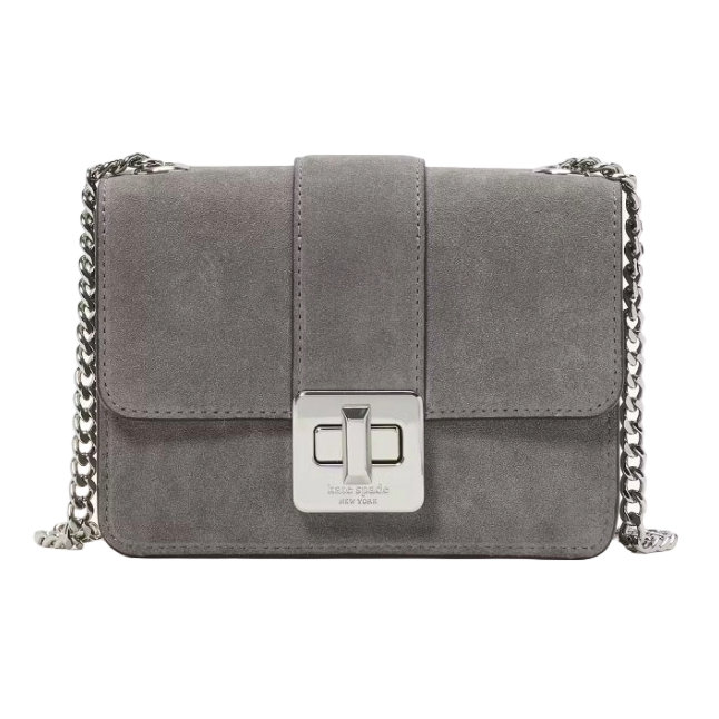 A gray suede crossbody bag with a chain strap and a front flap closure featuring a silver turn-lock clasp.