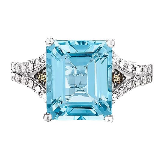 A Le Vian ring featuring a 6-carat emerald-cut blue topaz gemstone, accented with diamond embellishments on a split shank band, crafted in white gold.