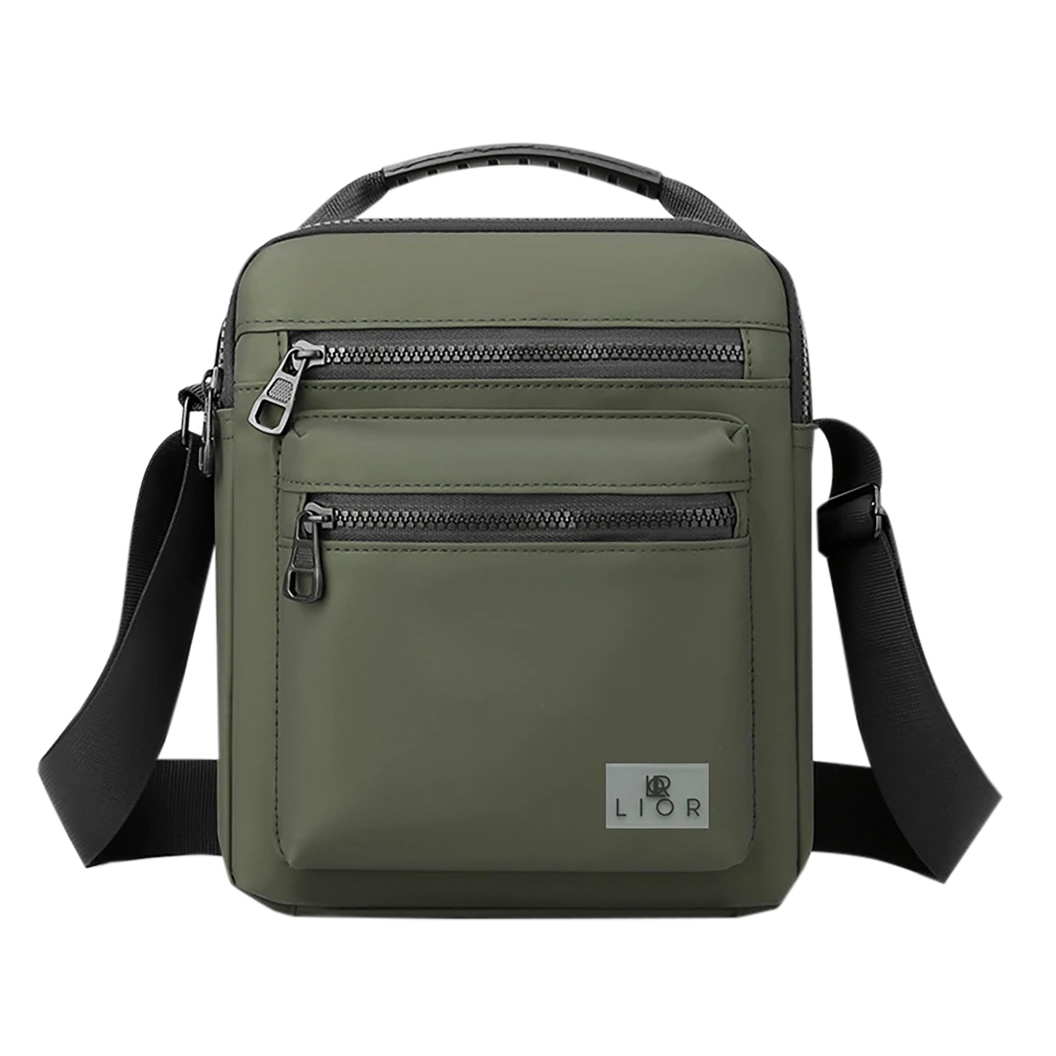 A green crossbody bag with black zippers and a handle, featuring two front zippered pockets and an adjustable black strap. The brand logo \“LIOR\“ is displayed at the bottom.