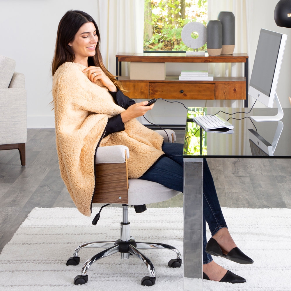 Two USB-powered heating blankets in beige, one worn by a seated woman, offering warmth and comfort with an easily accessible control unit.