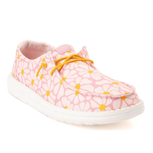 Hey Dude Daisy Shoes feature a pink floral pattern with white daisies and yellow centers, paired with white soles and yellow laces, offering a casual and vibrant look.