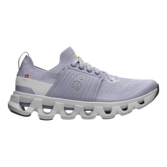 A lavender athletic shoe with a unique cloud-like sole design, featuring \“Cloudtec\“ technology and a subtle logo on the side, designed for comfort and performance.