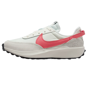 Nike Waffle Debut Shoes feature a retro-inspired design with a white upper, light gray suede overlays, and a prominent pink Swoosh logo. They have a thick, cushioned sole with a black waffle-patterned outsole for traction.