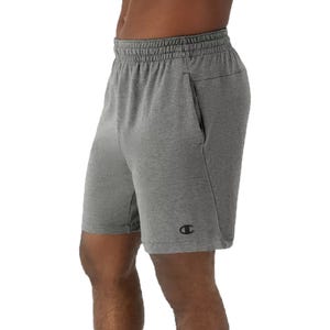 Gray athletic shorts with an elastic waistband and side pockets, featuring a small logo on the left leg.