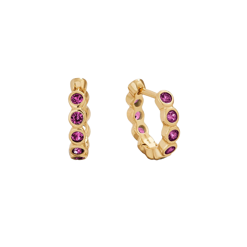 Gold hoop earrings with five pink gemstones set along the front, arranged in a decorative pattern.