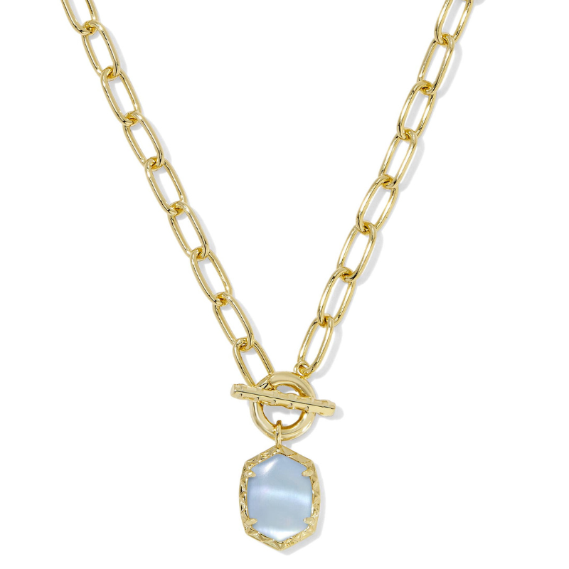 The Daphne Gold Link Necklace features a chain with elongated gold links and a toggle clasp. It showcases a pendant with a hexagonal iridescent stone framed in gold.