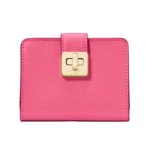 A pink leather wallet with a textured finish and gold-tone turn-lock closure.