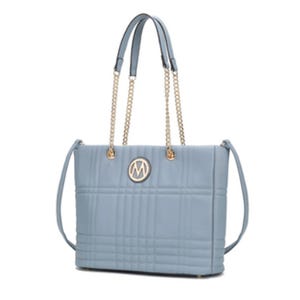 A light blue, rectangular handbag with gold chain handles and a circular logo on the front.