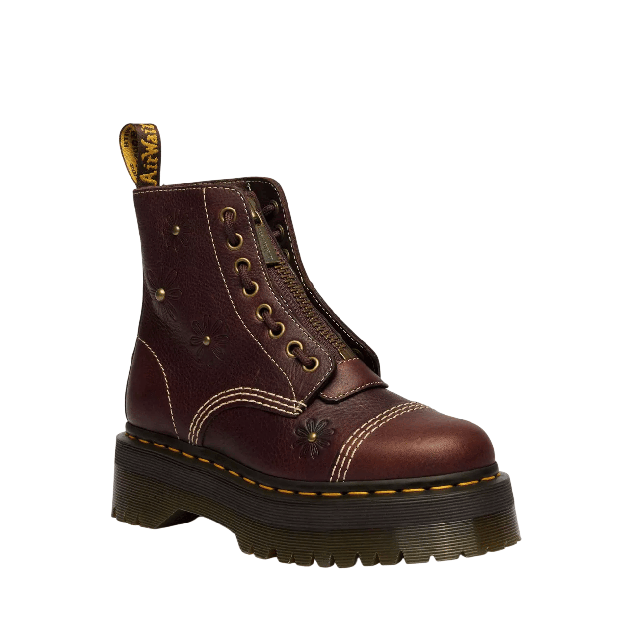 A maroon leather boot with embossed floral patterns, featuring a thick platform sole, yellow stitching, and a front zipper for closure.