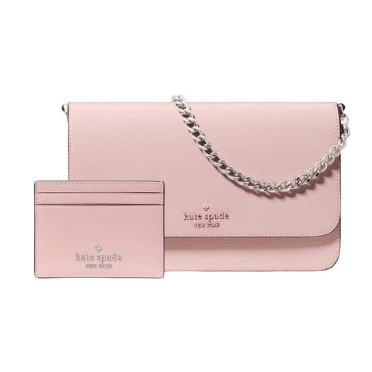A pink Kate Spade purse with a chain strap is shown alongside a matching cardholder, both featuring the brand's logo.