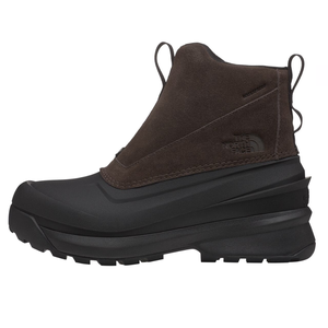 The North Face Men's Chilkat Boots feature a waterproof design with a brown suede upper and black rugged sole. They have pull tabs for easy wear and a logo embossed on the side for branding.