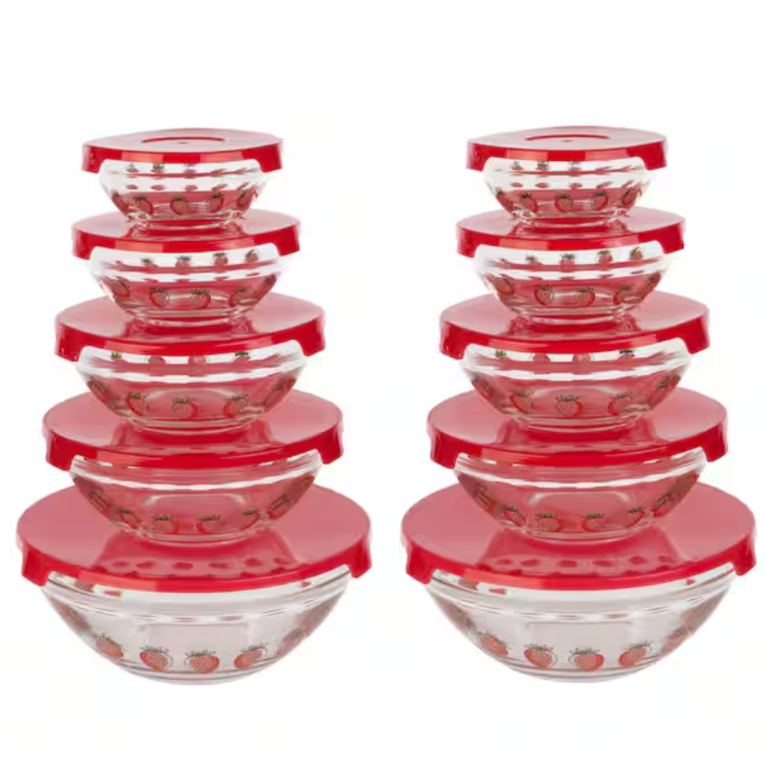 A set of clear glass bowls with red lids, each decorated with a pattern of strawberries.