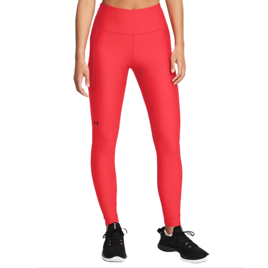 Red high-waisted leggings from Under Armour, featuring a small logo on the left thigh. They are paired with black athletic sneakers.