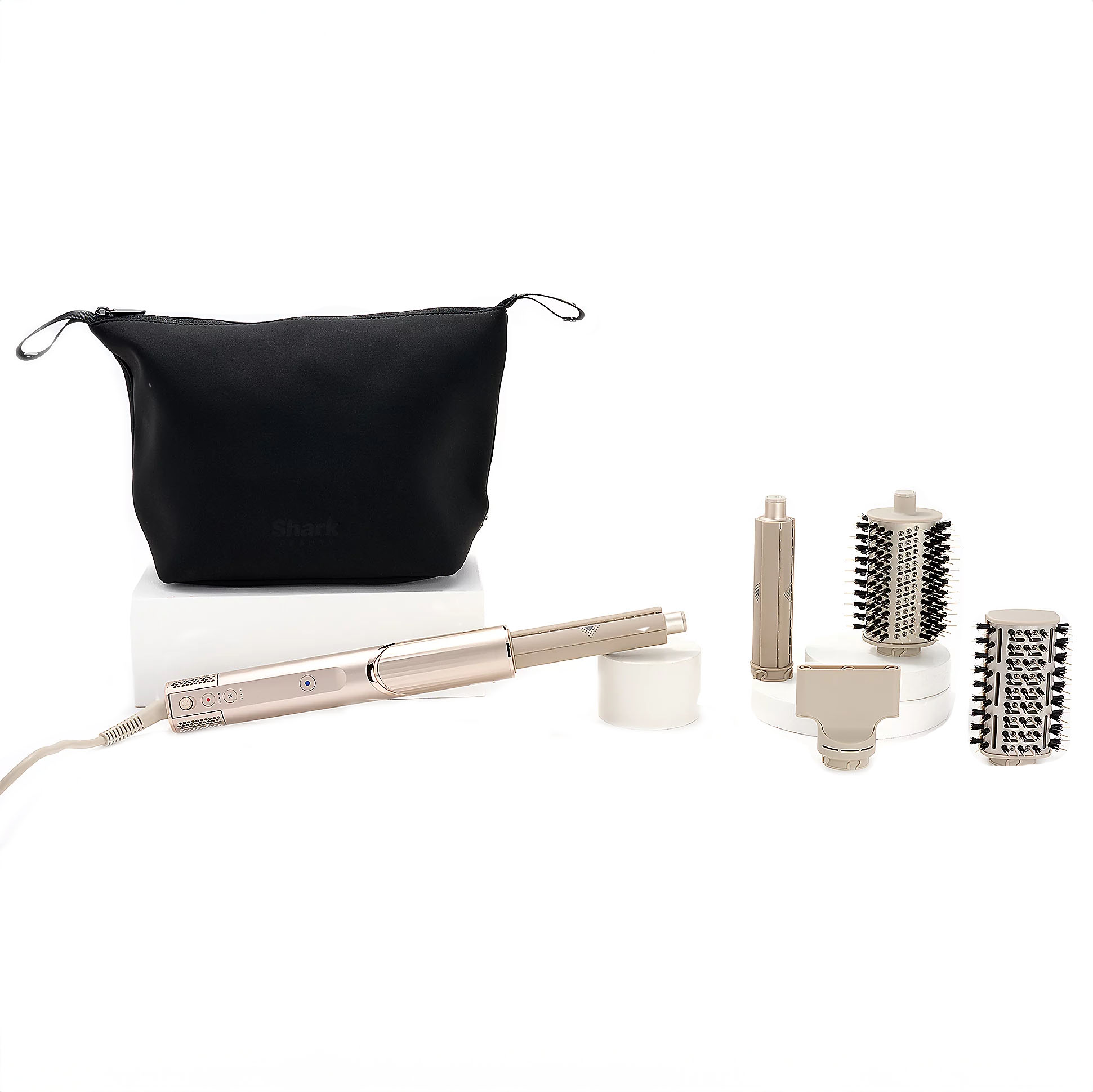 This is a Shark FlexStyle hair styling system with interchangeable attachments including a hair dryer, a straightening brush, a curling wand, and two round brush heads, accompanied by a black storage pouch.