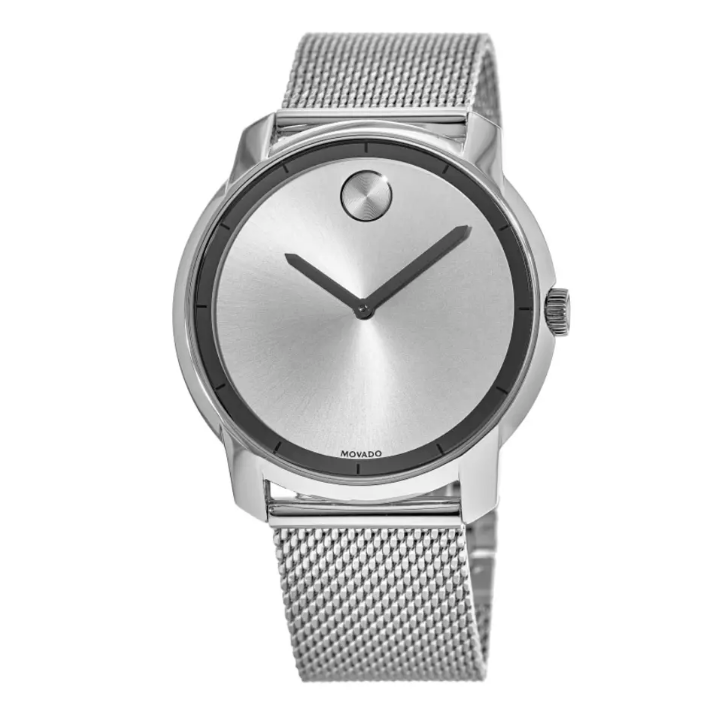 A minimalist silver wristwatch with a mesh band, featuring a round stainless steel case, a sunburst dial, and two black hands.