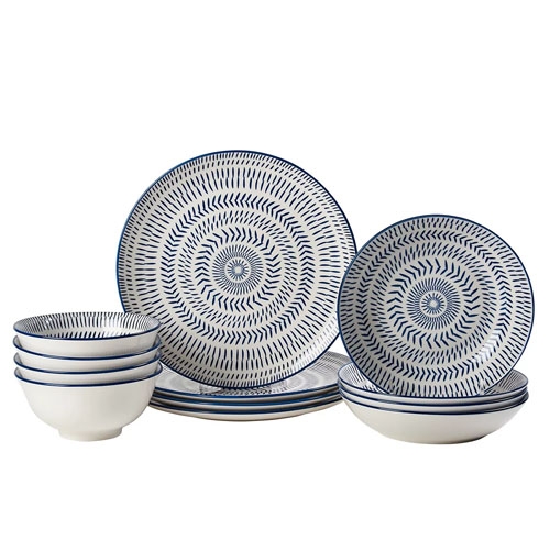 A set of blue and white patterned dinnerware, including plates, bowls, and salad plates.