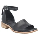 A black sandal with an ankle strap and open toe design, featuring a low stacked heel and buckle closure.
