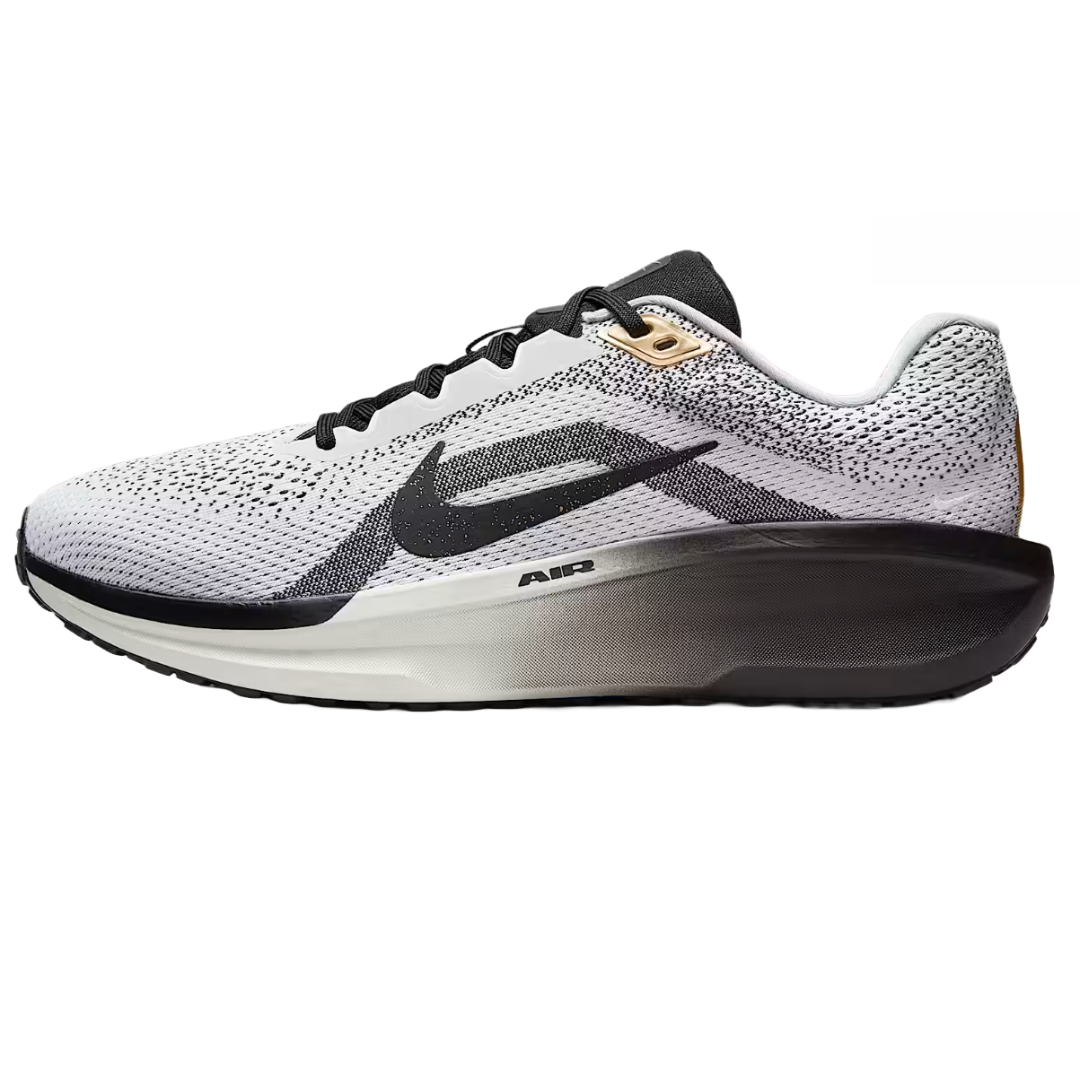 Nike Men's Winflo 11 SE Shoes feature a sleek white and black design with a knitted mesh upper, black swoosh, and contrasting gradient midsole with \“Air\“ branding for cushioning.