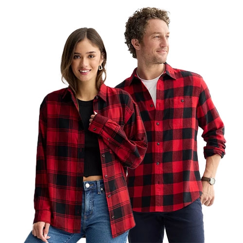 Two people wearing red and black plaid shirts; one person styles it over a black top and jeans, while the other pairs it with a white undershirt and dark pants.