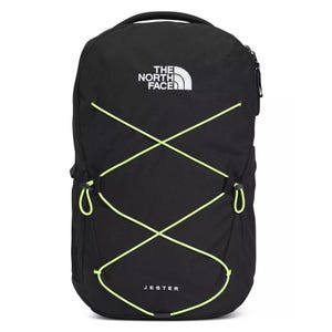A black North Face Jester backpack with neon green bungee cords and \“JESTER\“ text on the front, featuring a top handle and zippered compartment.