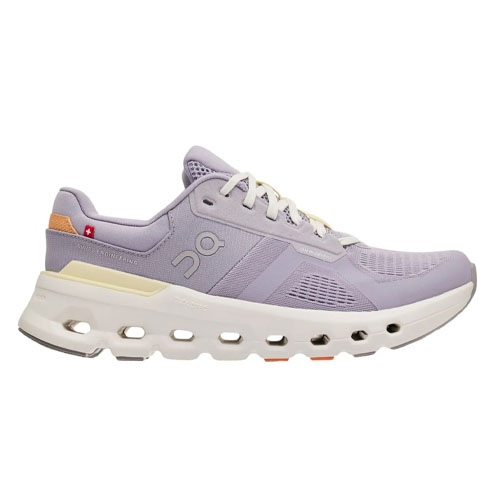 A lilac athletic shoe with a sleek design, featuring a breathable mesh upper, thick cushioned sole, and distinctive cut-out holes for enhanced airflow.