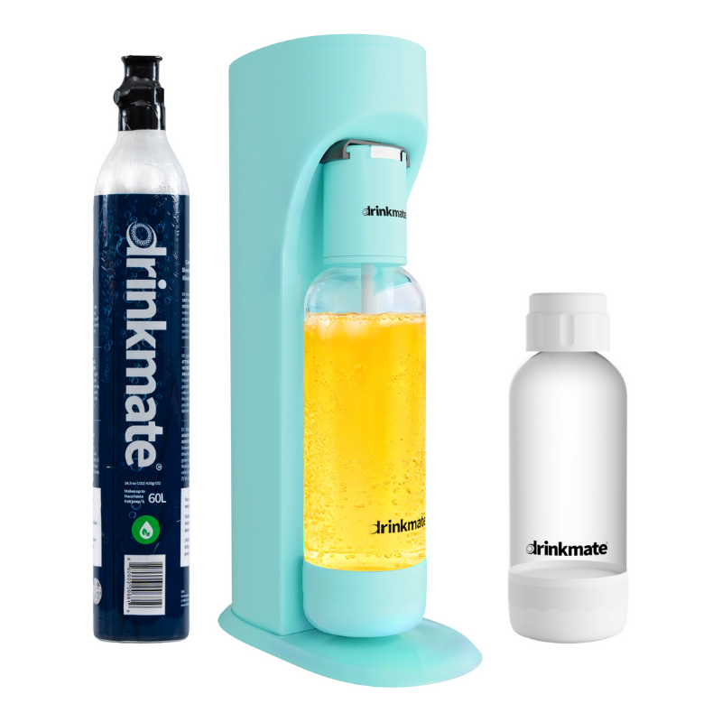 A Drinkmate beverage carbonator in aqua alongside a CO2 cylinder and a white reusable bottle.