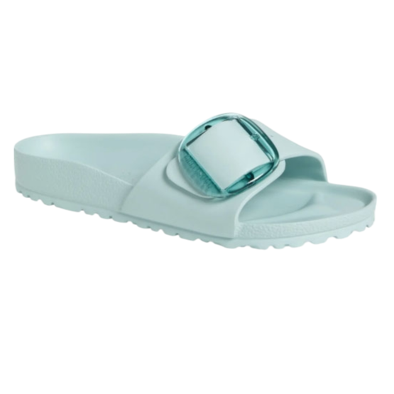 A light blue slide sandal with a textured footbed and a large buckle on the strap.