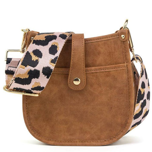 Brown faux leather crossbody bag with gold hardware, featuring a buttoned flap and a wide, detachable strap with a leopard print design.